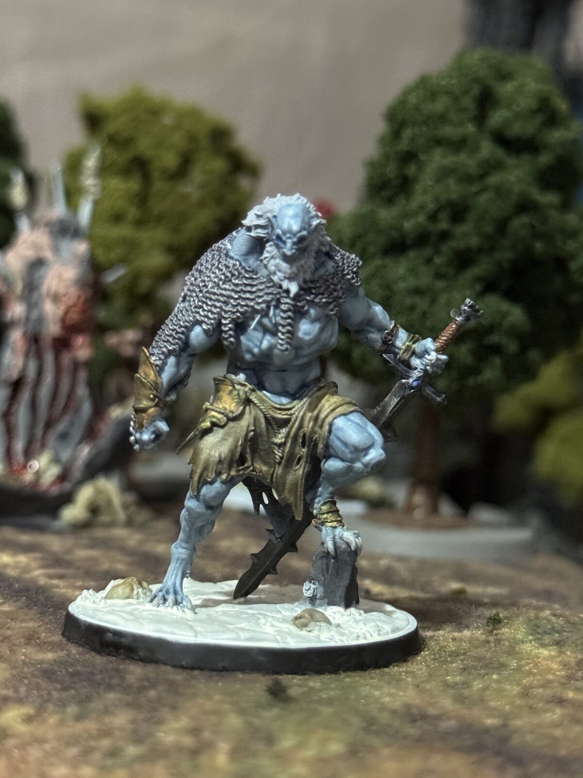 Blue-skinned Black Oaths warrior miniature with blade