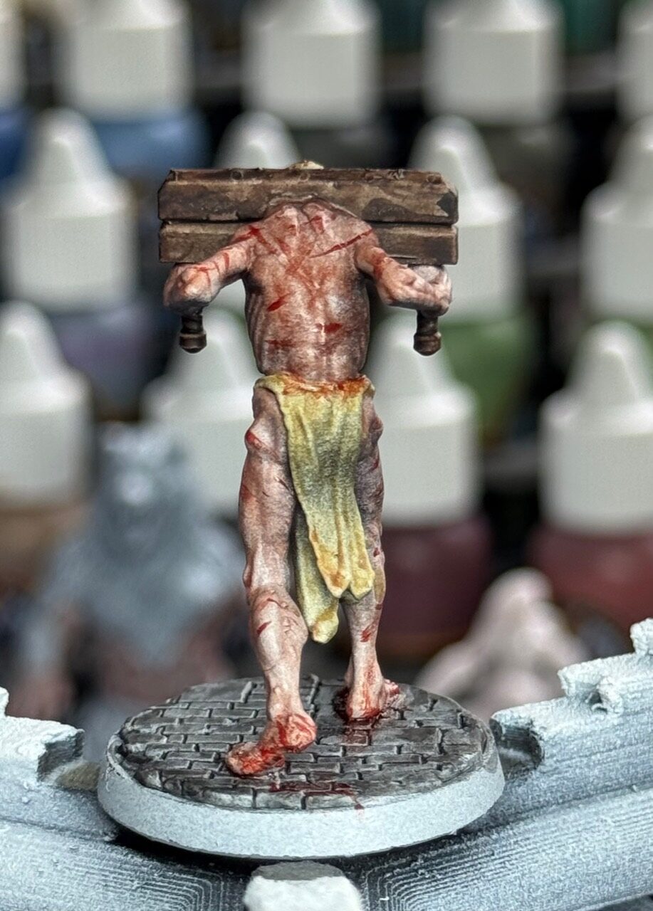 Black Oaths burdened captive miniature from the back