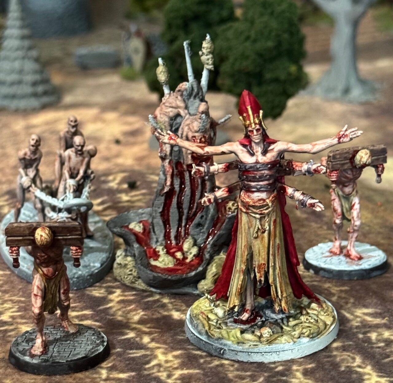 Blood-stained bishop miniature with followers