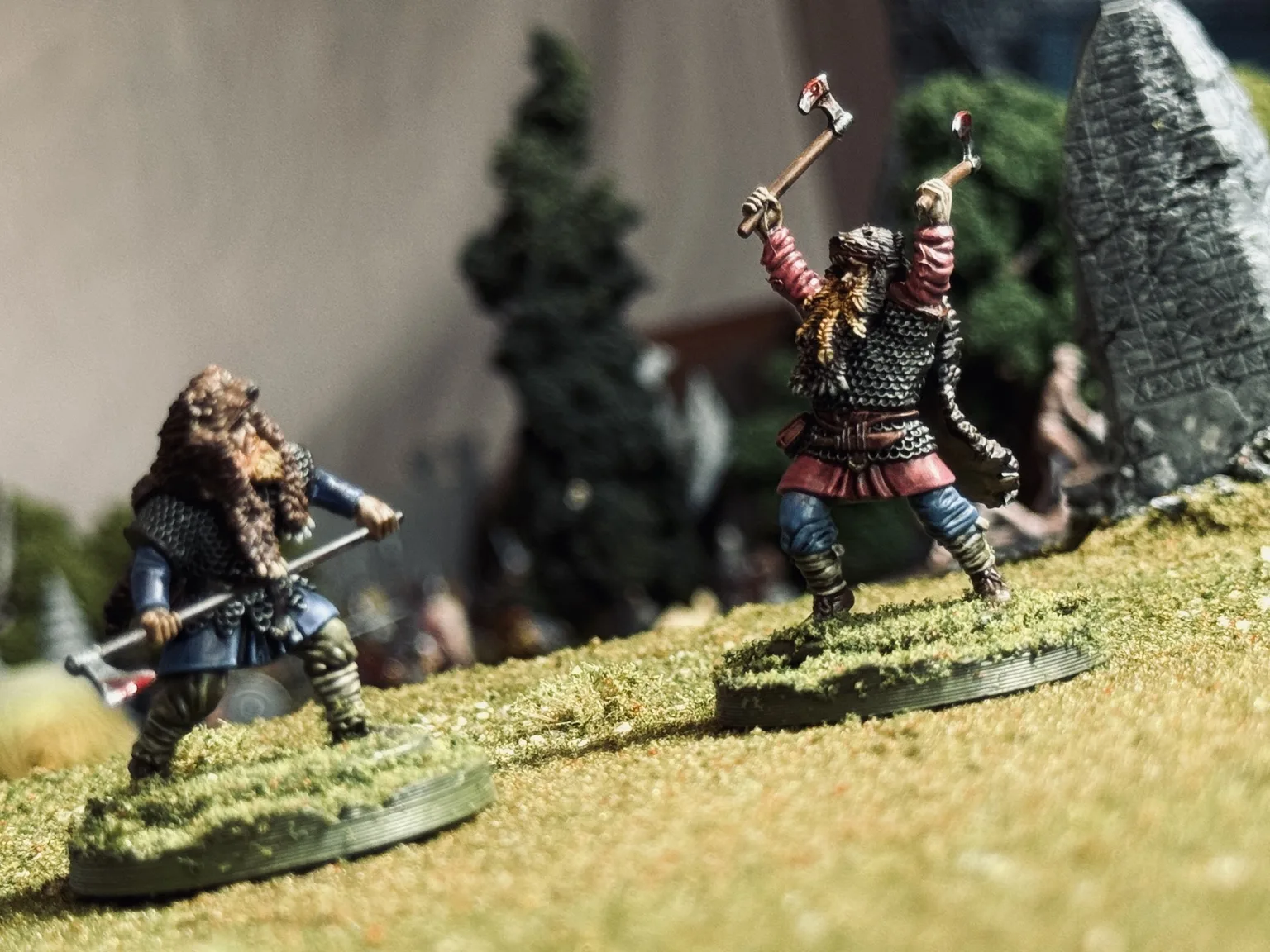 EINVIGI duel on a grassy battlefield with two fighters at distance