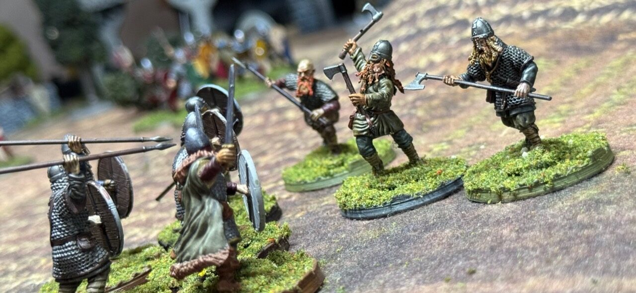 Oaths and Banners warriors closing with shield-bearing enemies