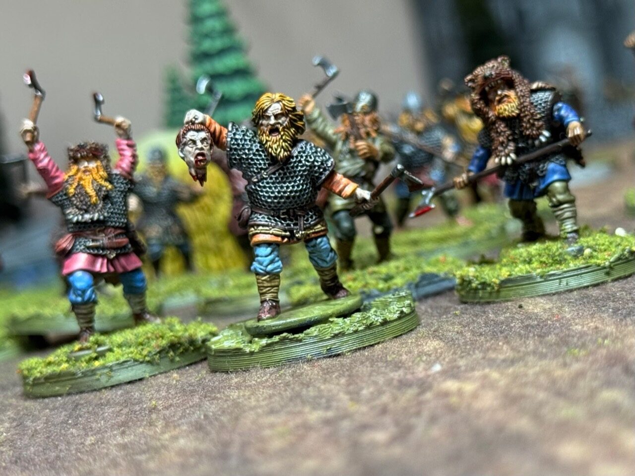 Oaths and Banners warrior holding a severed head