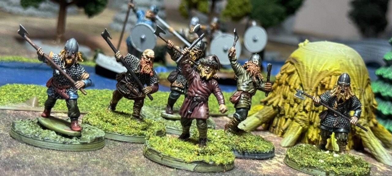 Oaths and Banners kin-warriors near a thatched hut